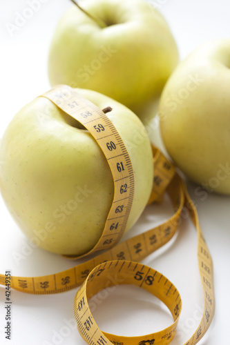 Photo: apples and measuring tape apples and measuring tape