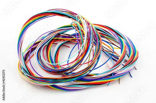 Photo: A bunch of colourful cables isolated on white background A bunch of colourful cables isolated on white background