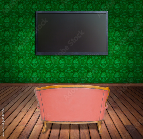 Photo: television and sofa in green wallpaper room television and sofa in green wallpaper room
