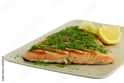 Photo: Salmon fish fillet grilled with green vegetables and lemon Salmon fish fillet grilled with green vegetables and lemon