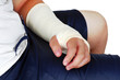 Broken hand in a plaster cast