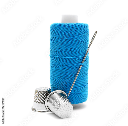 Photo: Threads, a needle and thimbles. Threads, a needle and thimbles.