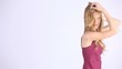 beautiful girl has her long blond hair, hands through his hair