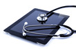 Digital tablet with stethoscope isolated on white