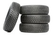Stack of four car wheel winter tires isolated