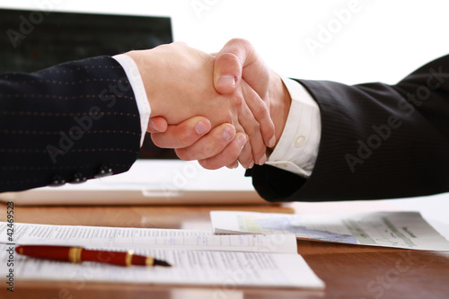Photo: Handshake of business partners Handshake of business partners