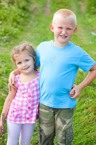Photo: Friendly boy and girl Friendly boy and girl