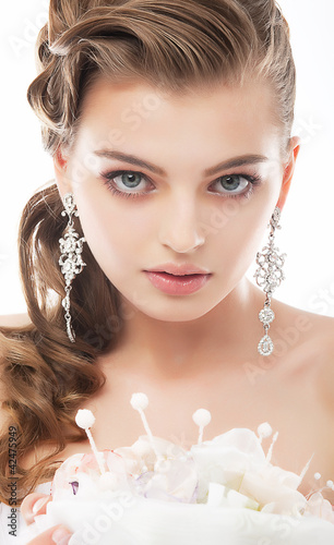 Photo: Young beautiful elegant bride isolated on white background Young beautiful elegant bride isolated on white background
