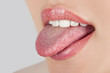 Young cheerful girl showing tongue
