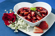 Photo: strawberries with red wine, cinnamon and brown sugar on a colore strawberries with red wine, cinnamon and brown sugar on a colore