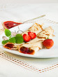 Rolled pancakes with strawberries