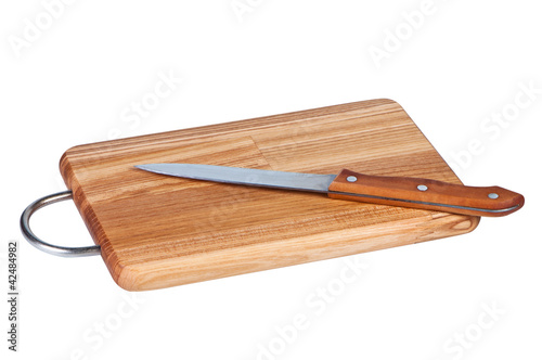 Photo: Wooden board with kitchen knife. Wooden board with kitchen knife.