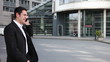 Business man laughing on cell phone