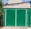 green garage door of the house