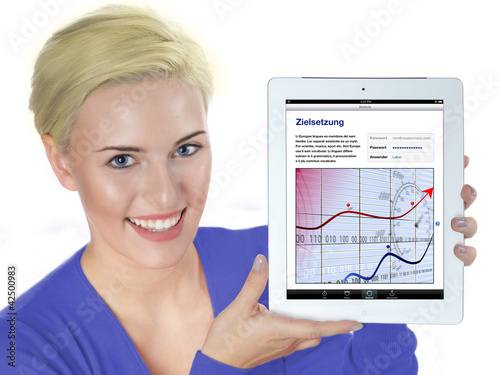 Foto: Pretty woman working on her tablet pc Pretty woman working on her tablet pc