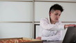 Young punk businesswoman eating pizza in the office, steadicam