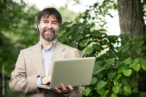 Photo: senior businessman smiling senior businessman smiling