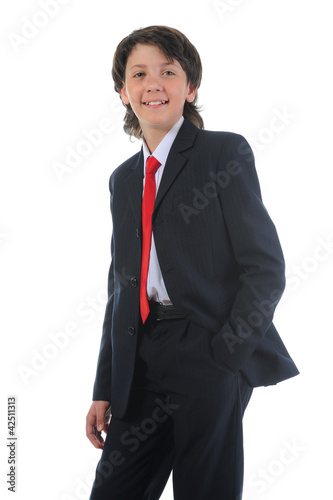 Photo: portrait of a boy businessman in a business suit portrait of a boy businessman in a business suit