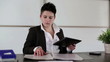 Young punk businesswoman with tablet computer in the office