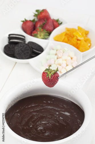 Photo: melted chocolate with fruits and cookies melted chocolate with fruits and cookies