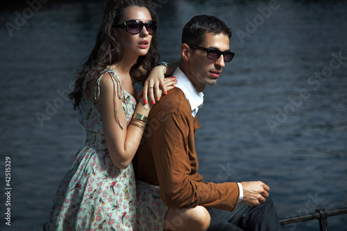 Photo: Young couple wearing sunglasses Young couple wearing sunglasses