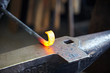 Incandescent element in the smithy on the anvil