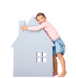 Cute little girl holding a big house icon on white
