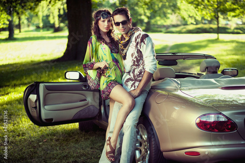 Photo: Handsome couple in cabriolet Handsome couple in cabriolet
