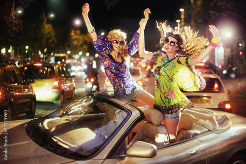 Photo: Two happy women in car Two happy women in car