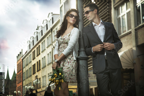 Photo: Adorable couple on the middle of a promenade Adorable couple on the middle of a promenade