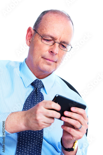 Photo: Businessman calling by phone. Businessman calling by phone.