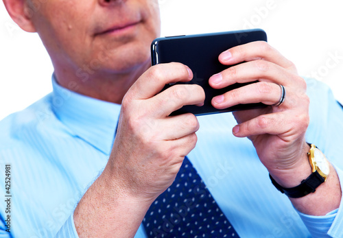 Photo: Businessman calling by phone. Businessman calling by phone.