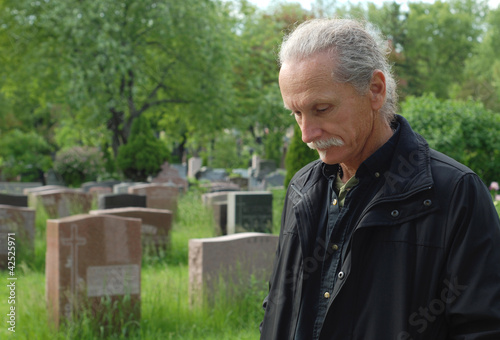 Photo: Man in cemetery Man in cemetery