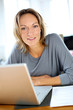 Foto: Woman working on laptop from home Woman working on laptop from home