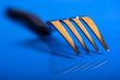 Single fork on blue background