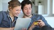 Young couple at home buying on internet