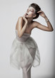 Theatre. Actress woman in dramatic pose - white clothes isolated