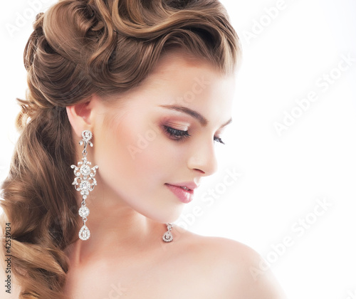Photo: Beautiful female wedding model isolated on white background Beautiful female wedding model isolated on white background