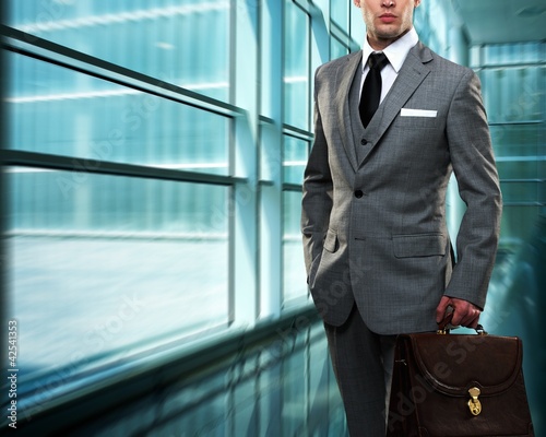 Photo: Businessman inside modern building Businessman inside modern building