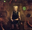 Woman in a bunker with zombie hands around her