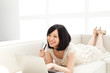 Beautiful young woman using a laptop computer. Portrait of asian