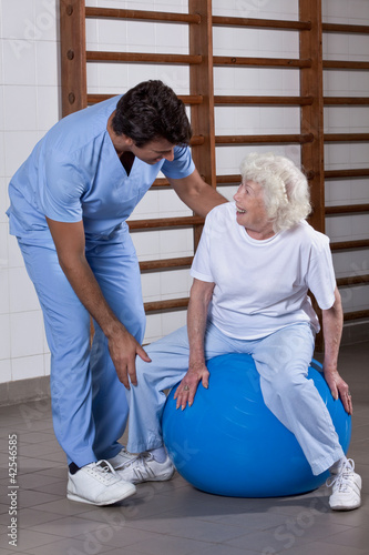 Photo: Physical Therapist helping a Patient Physical Therapist helping a Patient