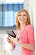 Attractive woman using digital tablet outdoors