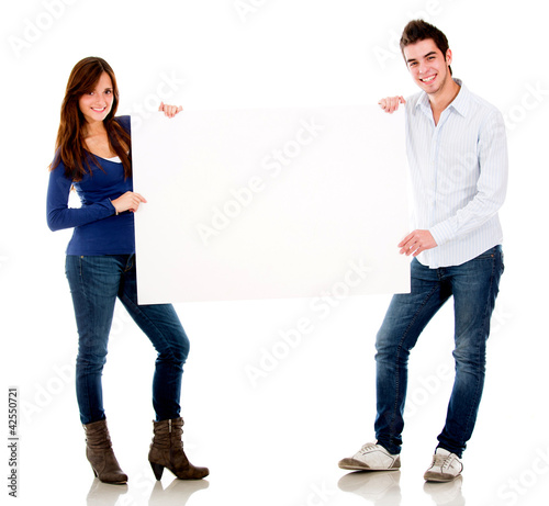Foto: Couple holding a banner Couple holding a banner