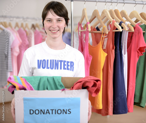 Photo: Volunteer with clothing donation Volunteer with clothing donation
