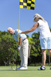 Happy Senior Couple Playing Golf & Putting Together