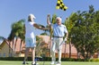 Happy Senior Couple Playing Golf & Putting Together