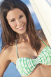 Beautiful Woman Surfer In Bikini With Surfboard At Beach