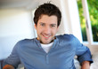 Portrait of cheerful young guy with blue eyes