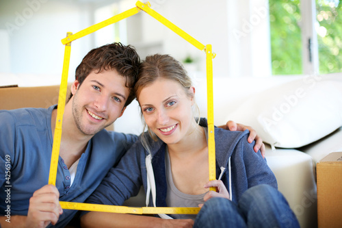 Photo: Portrait of happy young property owners Portrait of happy young property owners